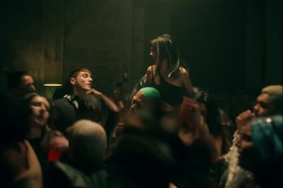 a group of people standing around each other