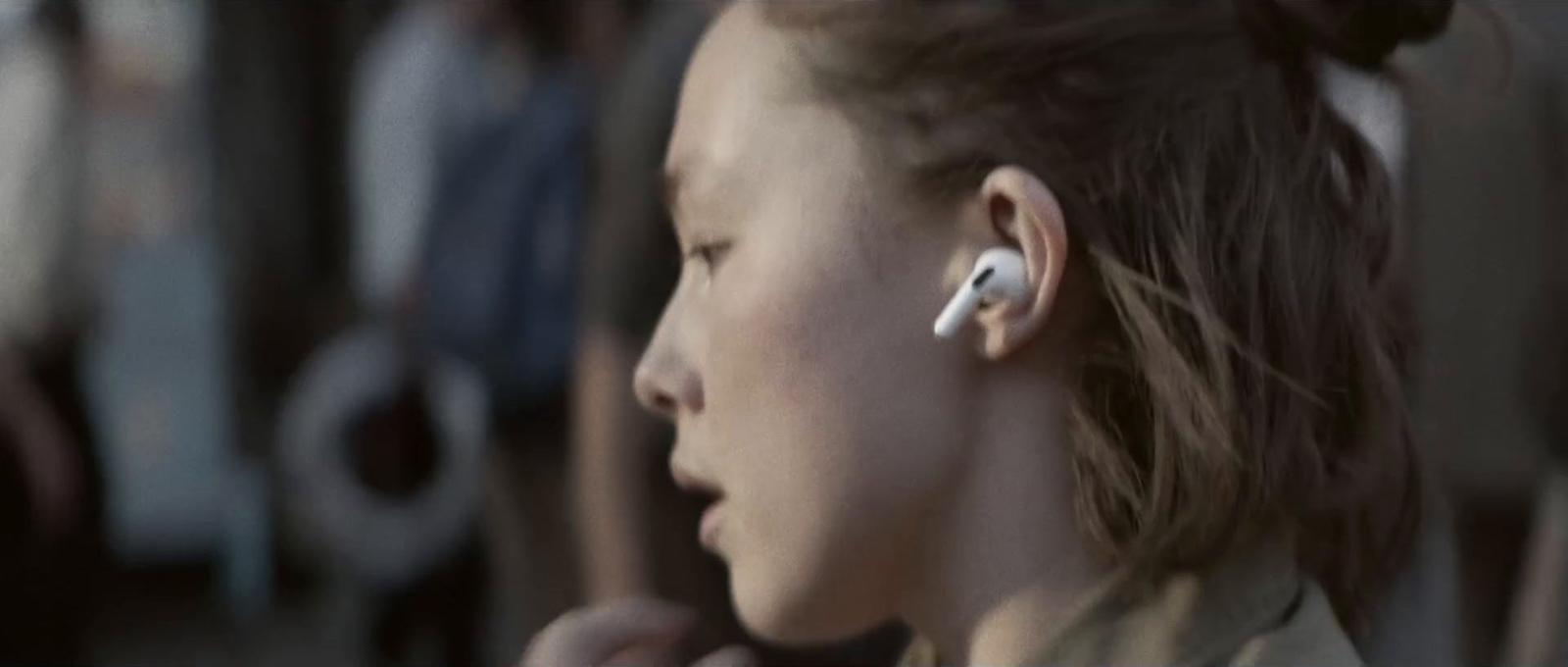 a young girl wearing a pair of ear buds