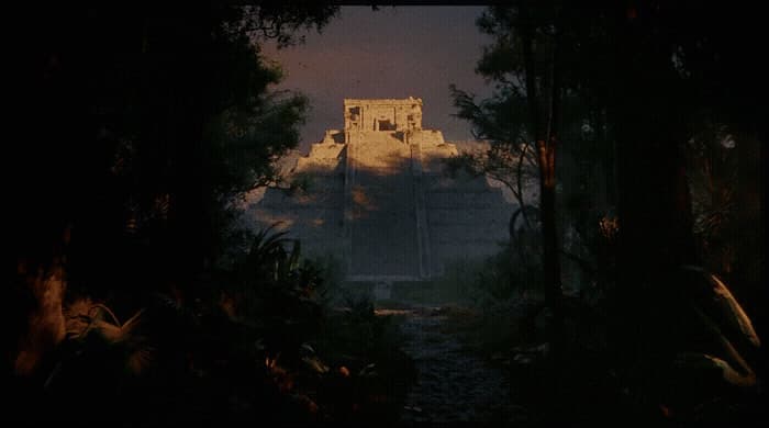 a large building in the middle of a forest