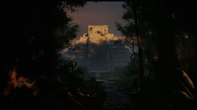 a large building in the middle of a forest