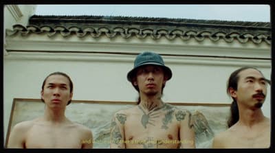 a group of three men standing next to each other