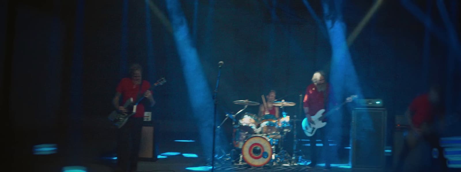 a group of people that are standing on a stage