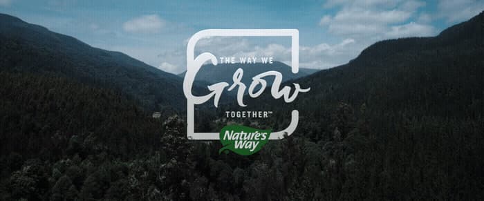 a picture of a mountain range with the words grow together