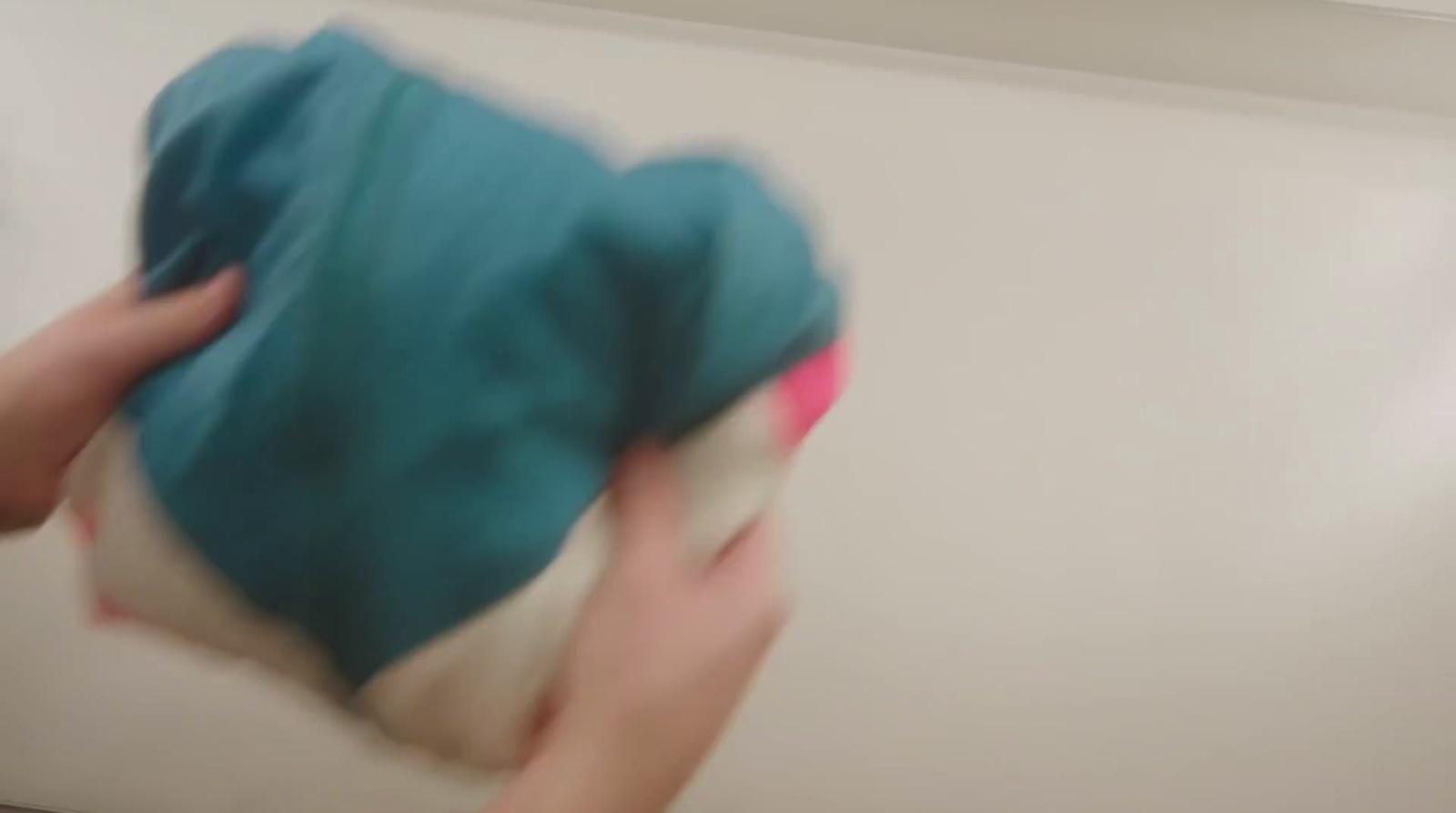 a blurry image of a person holding a bag