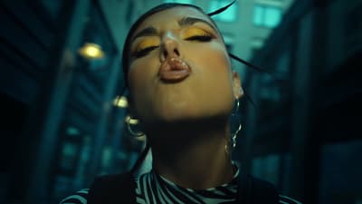 a woman with her eyes closed and her tongue out