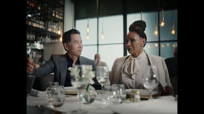a man and a woman sitting at a table