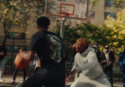 a group of young men playing a game of basketball