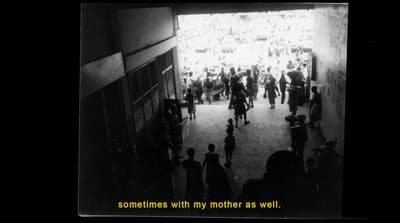 a black and white photo of a crowd of people