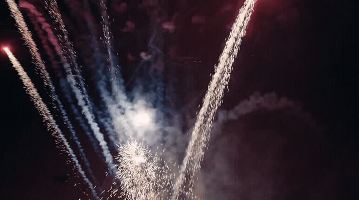 a bunch of fireworks are lit up in the night sky