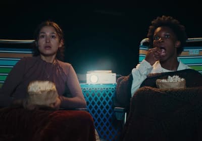 a couple of people sitting next to each other