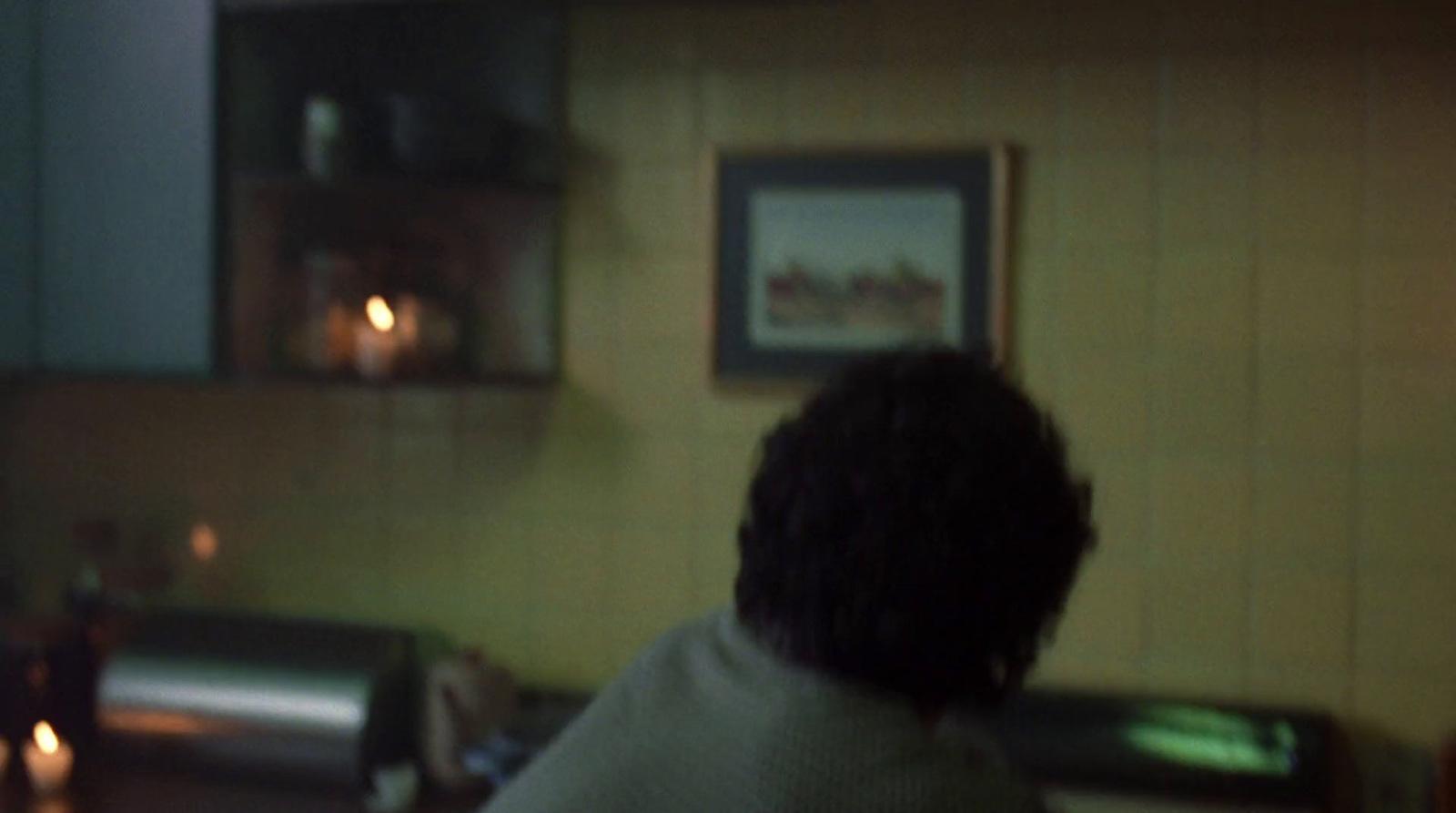 a blurry photo of a person in a kitchen