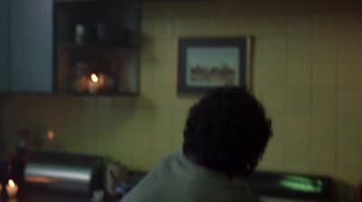 a blurry photo of a person in a kitchen