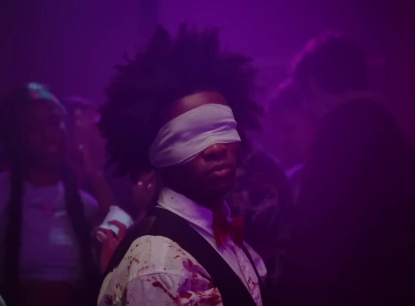 a man with a blindfold on his face