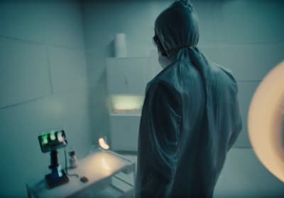 a person standing in a room with a mirror