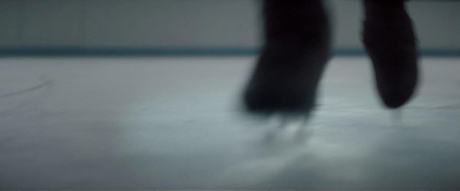 a blurry photo of a person's feet on a skateboard