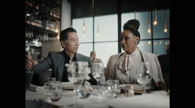 a man and a woman sitting at a table