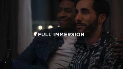 a couple of men sitting next to each other