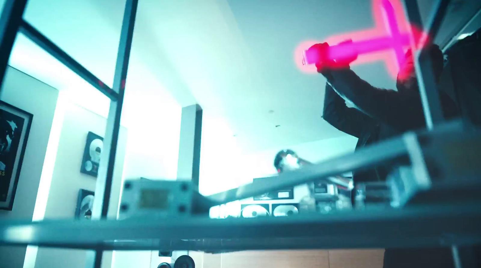 a man holding a neon pink object in his hand