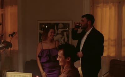 a man and a woman standing in a living room