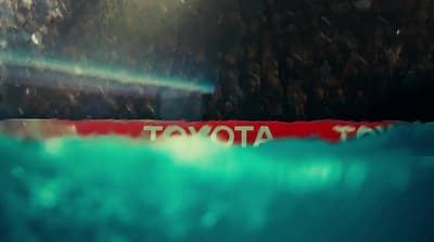 a picture of a toyota sign in the water