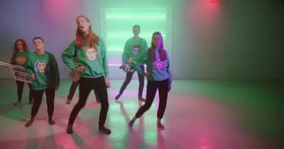 a group of people standing in a room