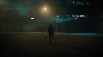 a man walking in the dark at night