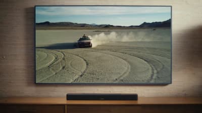 a picture of a car driving in the desert
