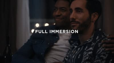 a couple of men sitting next to each other