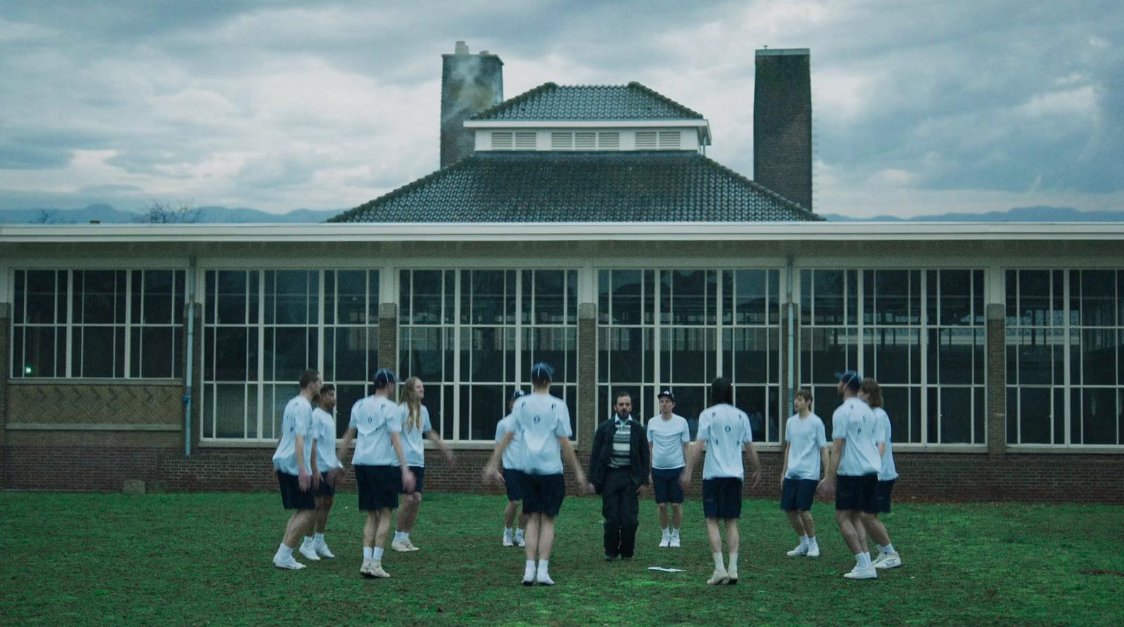 a group of people standing in front of a building
