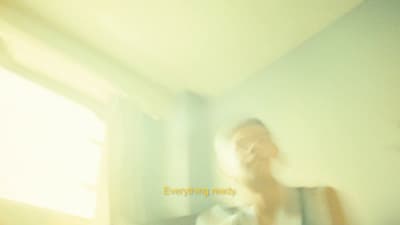 a blurry photo of a person standing in a room