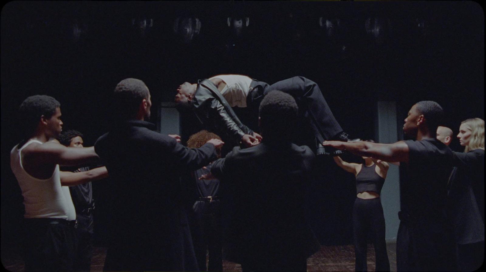 a group of people standing around each other