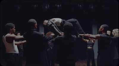 a group of people standing around each other