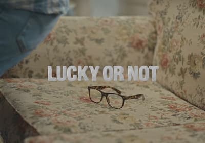 a pair of glasses sitting on top of a couch