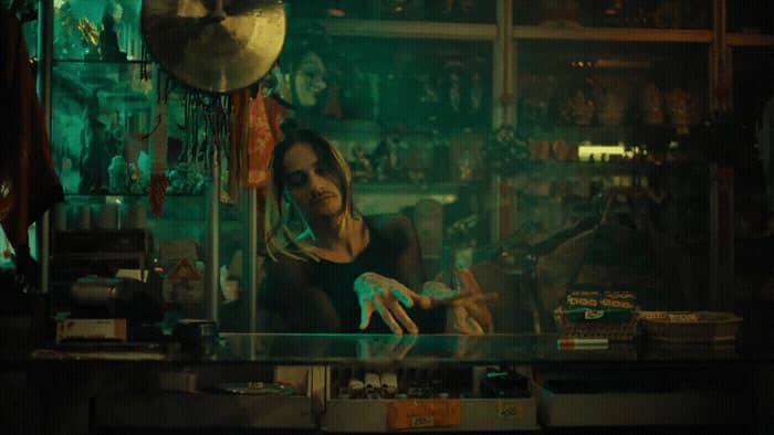 a woman sitting at a counter in a store