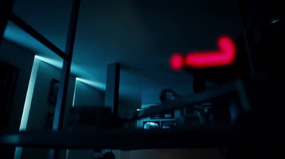a blurry image of a red light in a dark room