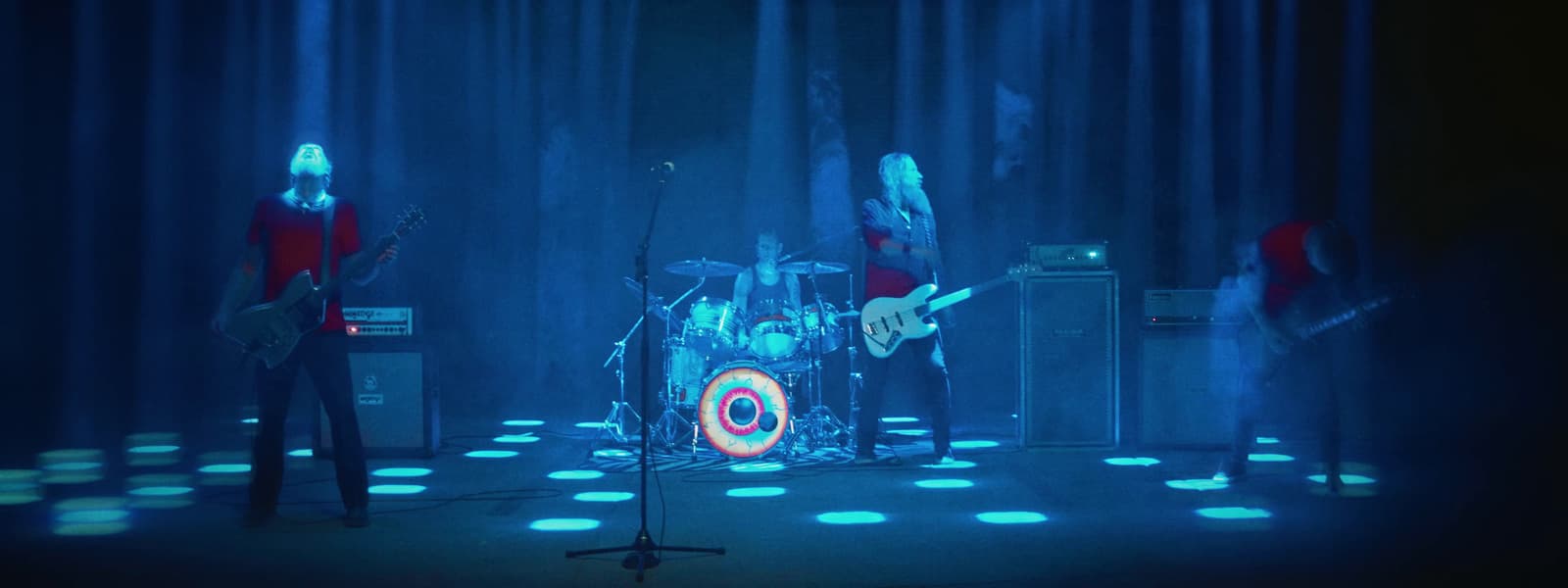 a group of people that are standing on a stage