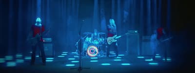 a group of people that are standing on a stage