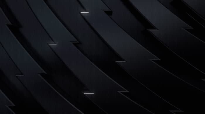 a cell phone with a black background and a black wall