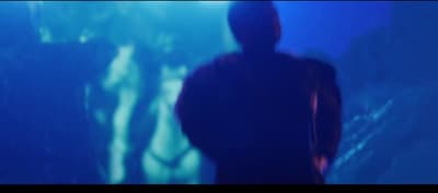 a blurry image of a person in a dark room