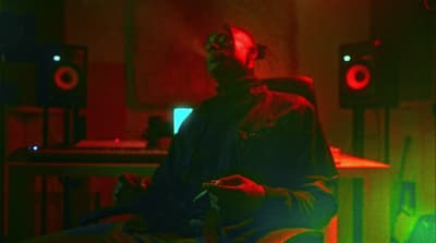 a man sitting in a chair in a room