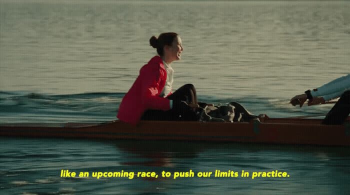 a man and a woman in a canoe on the water