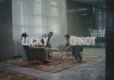 a group of people sitting around a living room