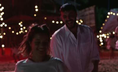 a man and a woman standing next to each other