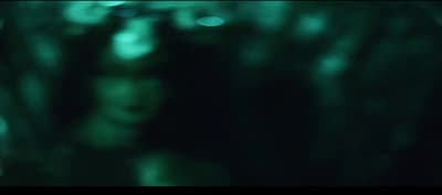 a blurry photo of a person with a cell phone