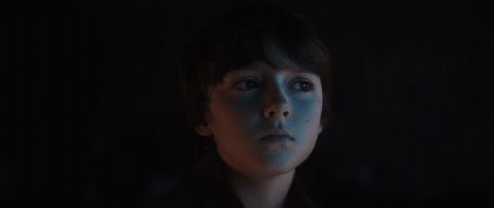 a woman with blue light on her face