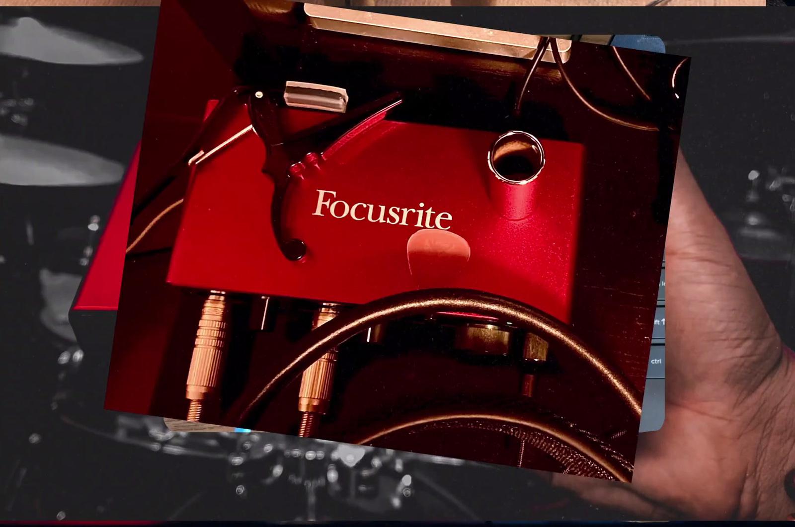 a person holding a red box with a pair of scissors in it