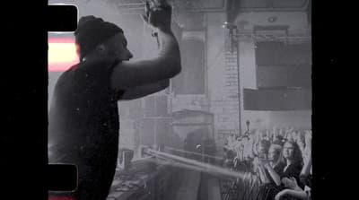 a man standing in front of a crowd of people