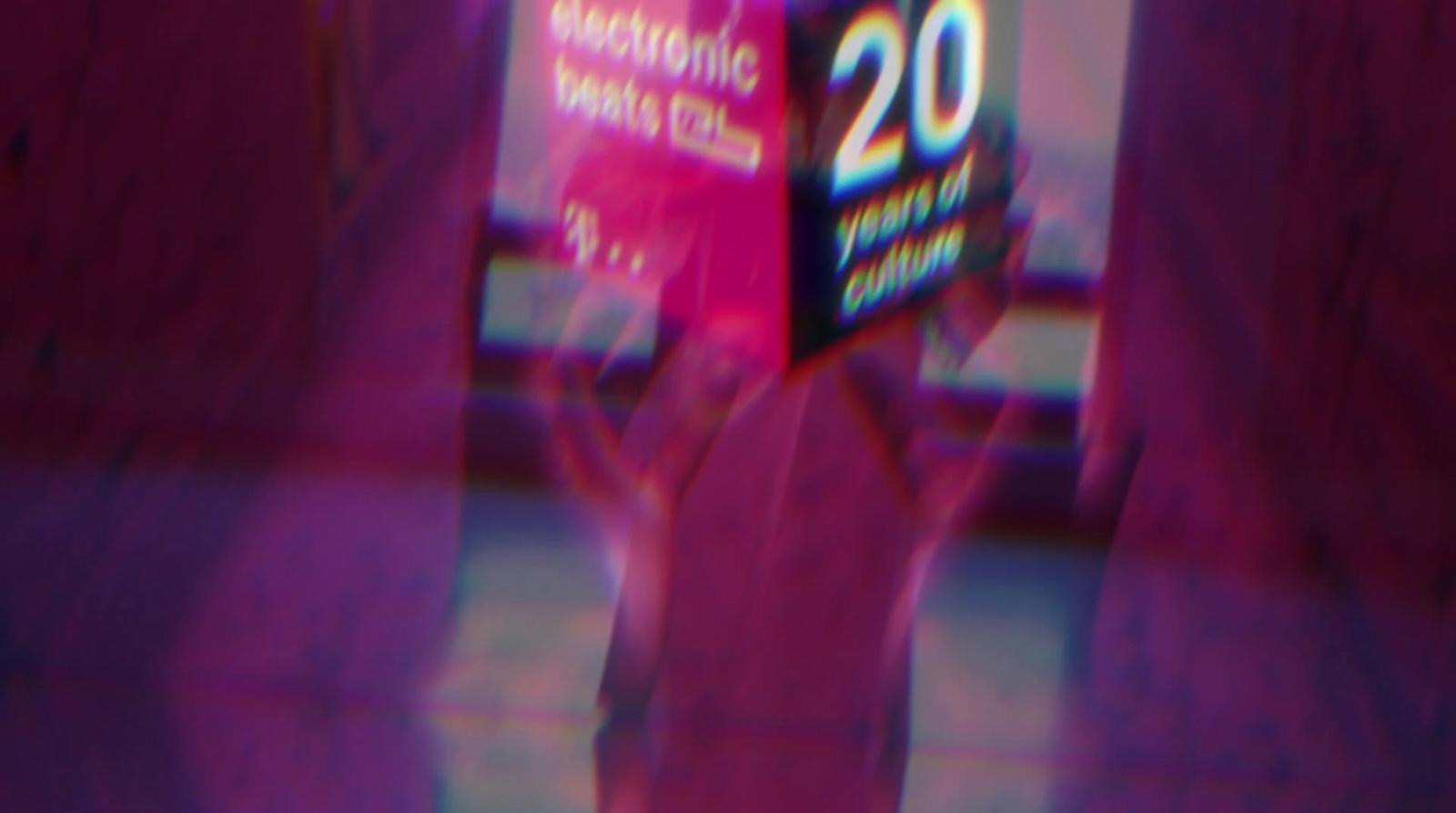 a blurry image of a person holding a box