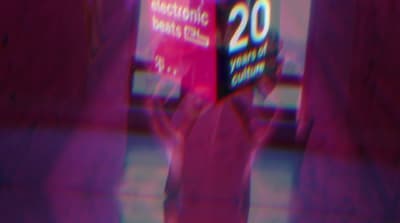 a blurry image of a person holding a box