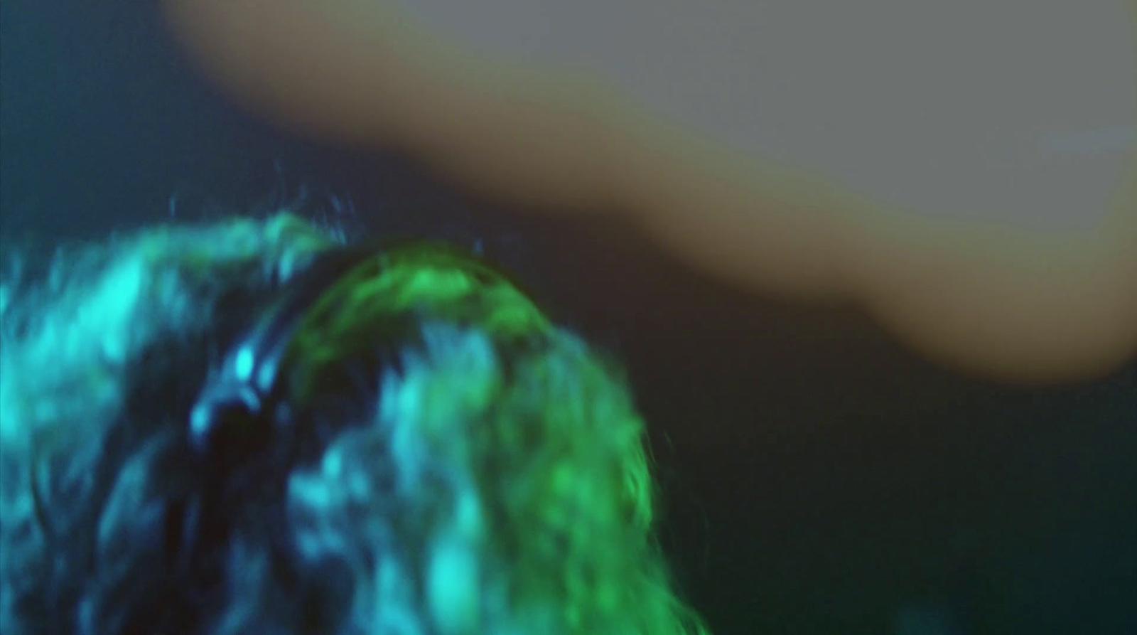 a blurry photo of a person with a cell phone